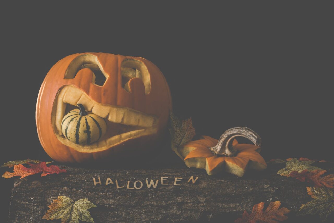 jack o lantern on brown wooden surface